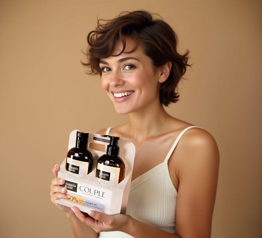 Nuggela Imperial Conditioner and N1 Shampoo set held by a smiling woman, showcasing anti-hair loss benefits and vitality for hair.