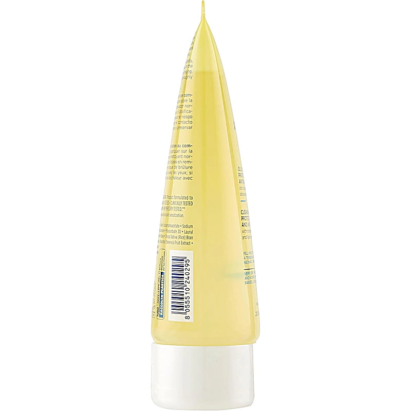 Back view of a yellow and white cosmetic bottle with text and a barcode on a white background