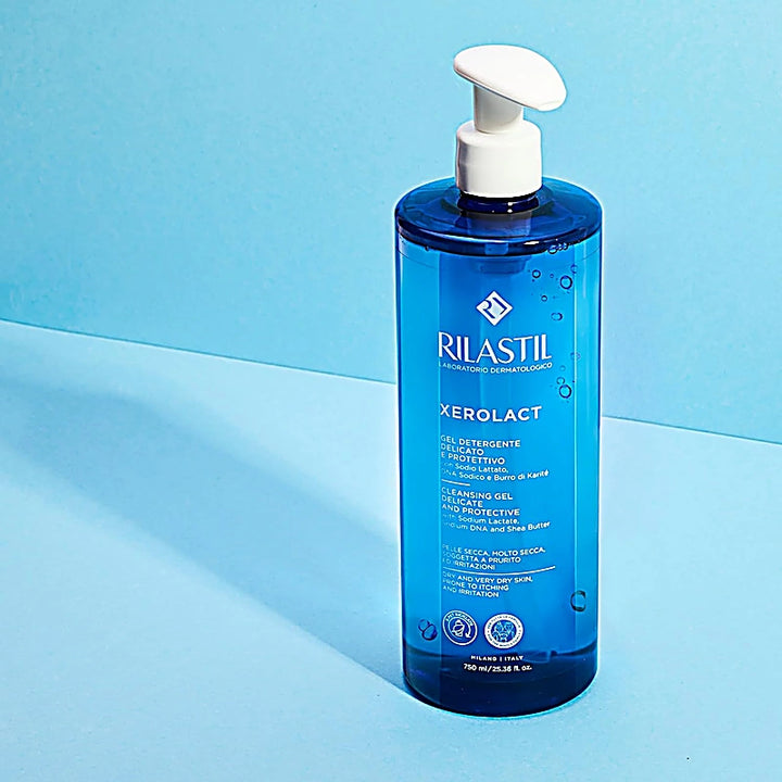 Blue bottle of Rilastil Xerolact on a light blue background