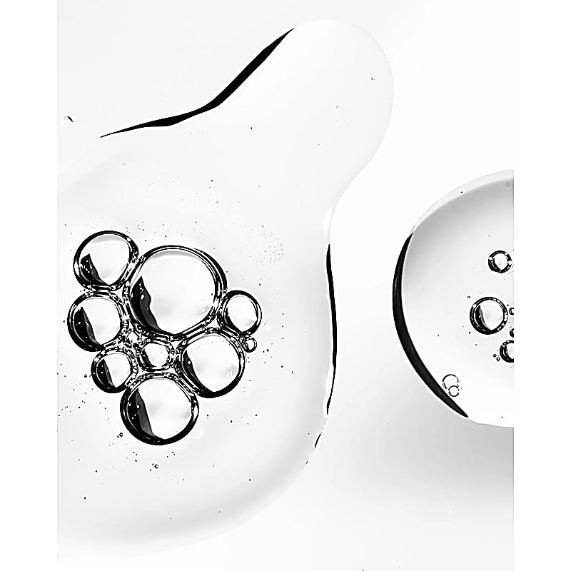 Close-up of a clear glass with bubble design on a white background