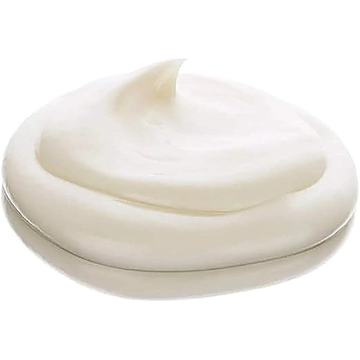 Close-up of a swirl of white cream on a white background