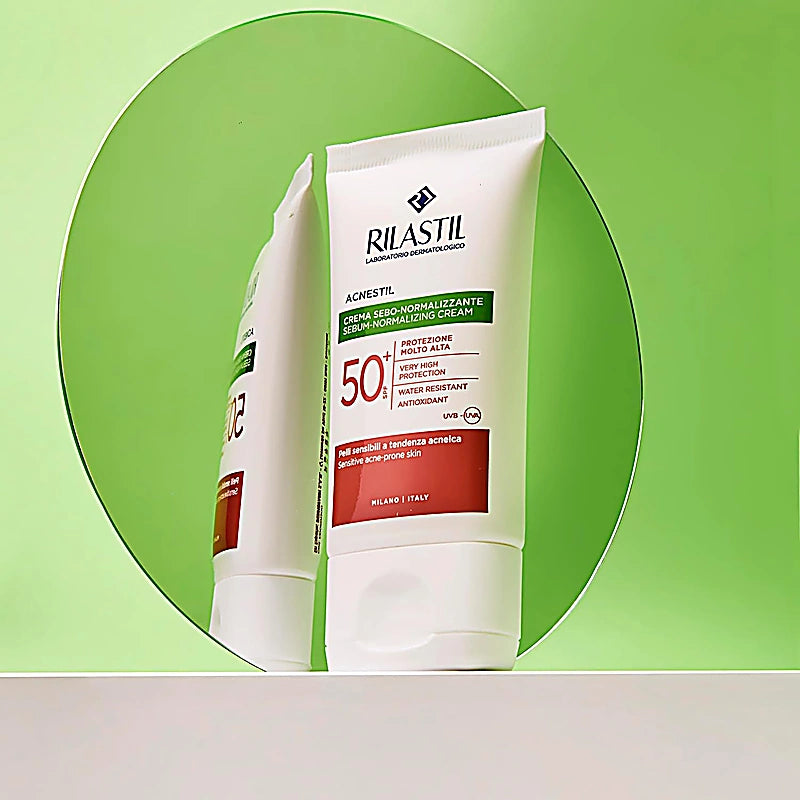 Rilastil skincare cream packaging on a green background