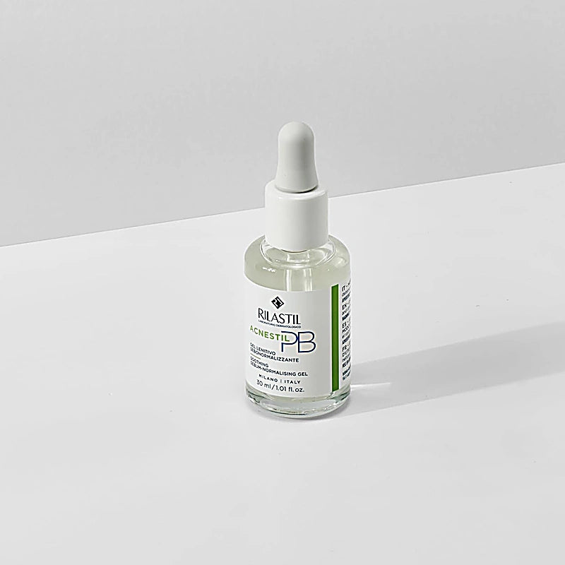 Rilastil skincare dropper bottle on a light gray background