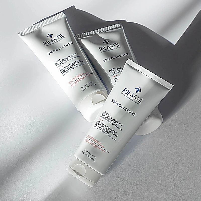 Three Rilastil Smagliature skincare products on a light gray background