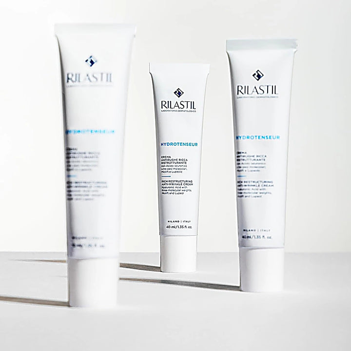 Three Rilastil skincare products on a white background