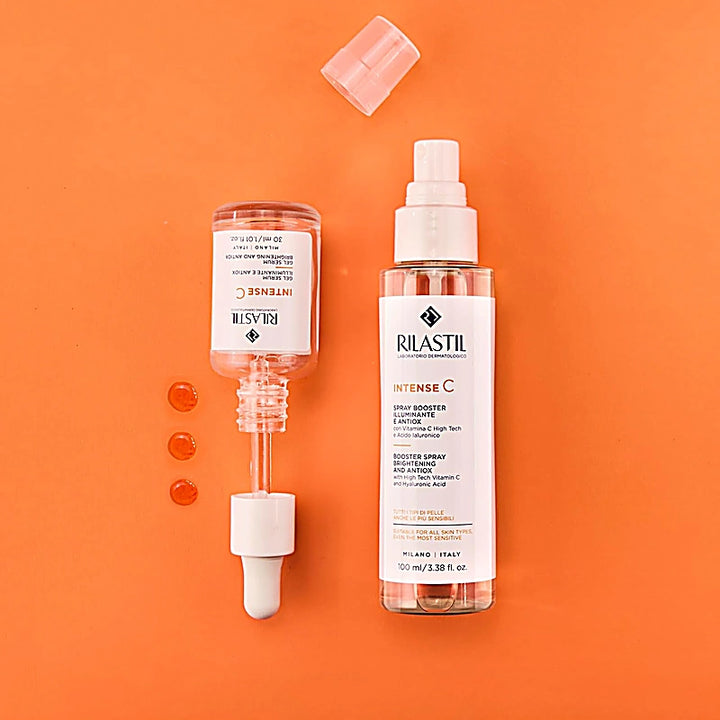 Two RILASTIL skincare products on an orange background