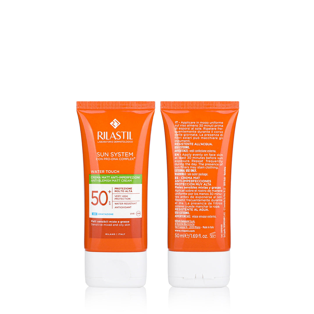 Two orange Rilastil sun cream tubes on a white background
