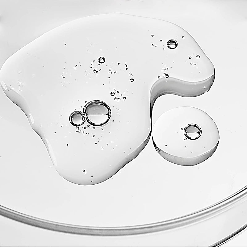 White gel-like substance with bubbles on a white background
