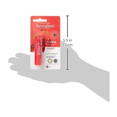 Beesline Lip Care Shimmery Cherry lip balm moisturizing and soothing dry lips with natural beeswax and oils