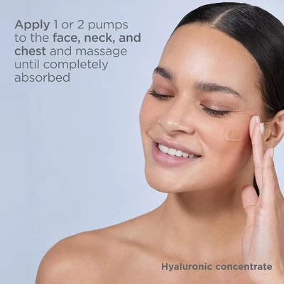Woman applying ISDIN Isdinceutics Hyaluronic Concentrate serum to her face with smooth skin and closed eyes